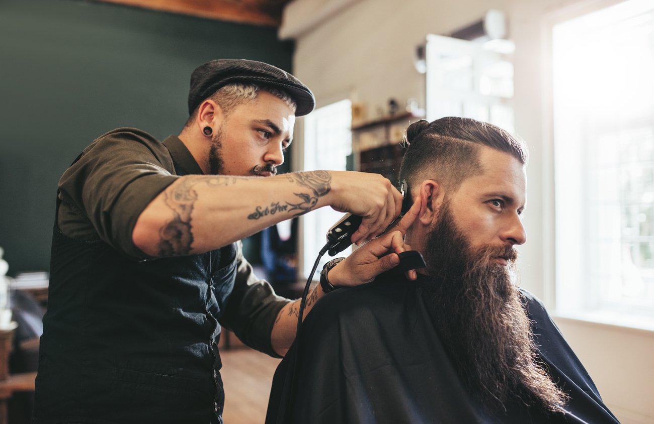 Man Getting Trendy Haircut in Barbershop