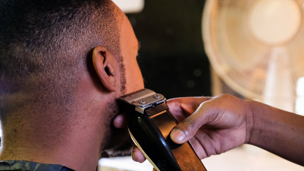 Barber trimming those sideburns