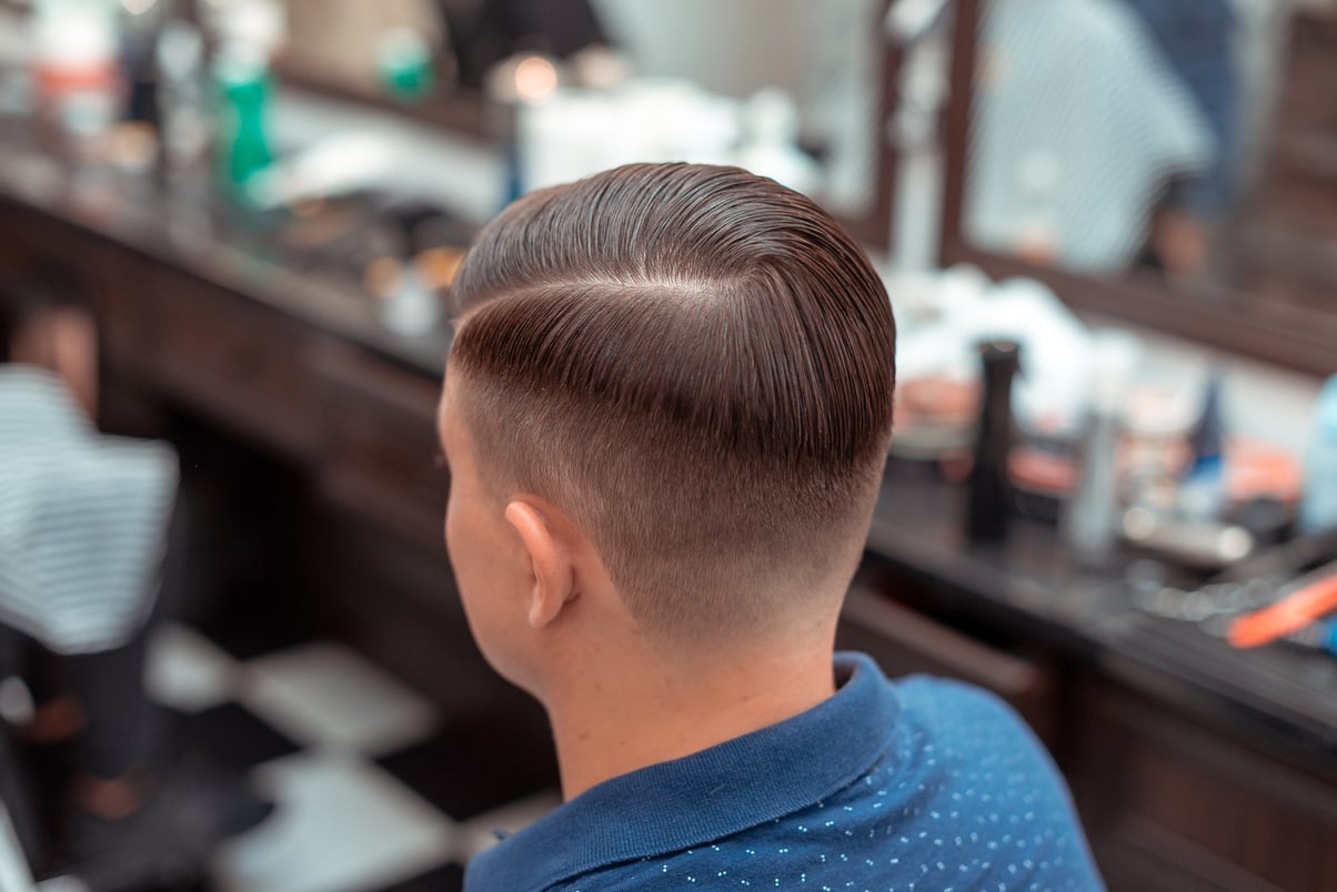 Men's haircut and styling in barbershop. Stylish Haircut Haircut.